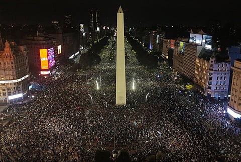 Fans celebrate Argentina's victory over England in a World Cup semifinal soccer match around the Obelisk in downtown Buenos Aires, Argentina, Wednesday, July 15, 2026. 