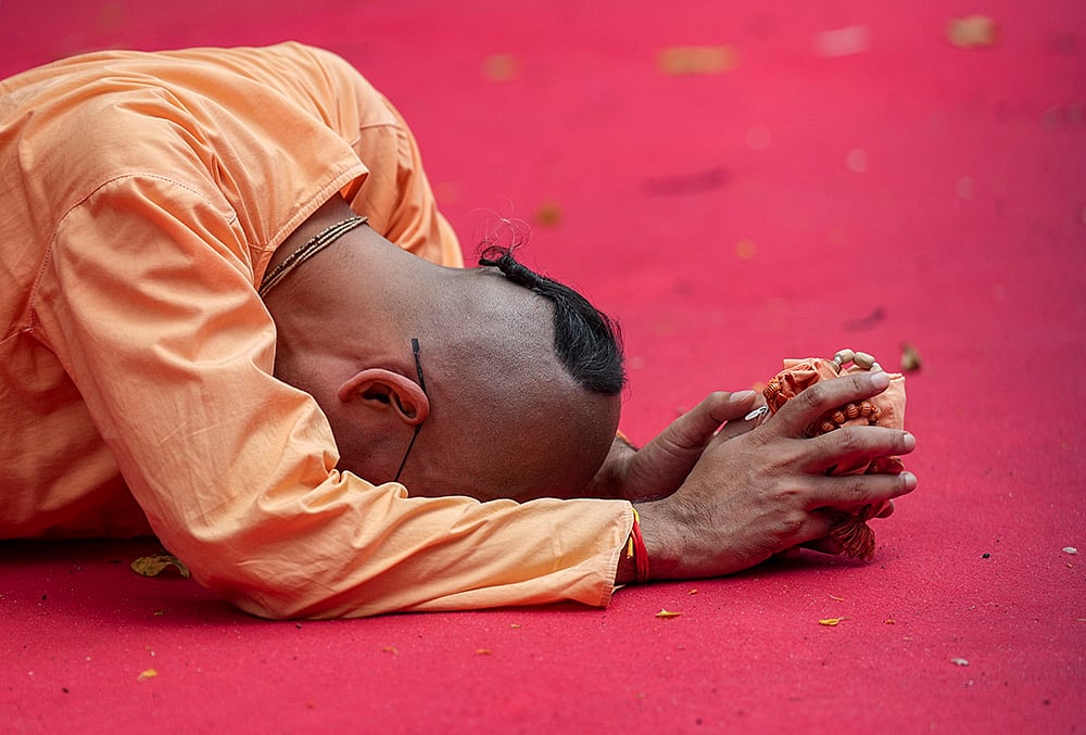 A man offers prayers during the annual Rath Yatra festival celebration organised by ISKCON, in Kolkata, West Bengal, Thursday, July 16, 2026. 