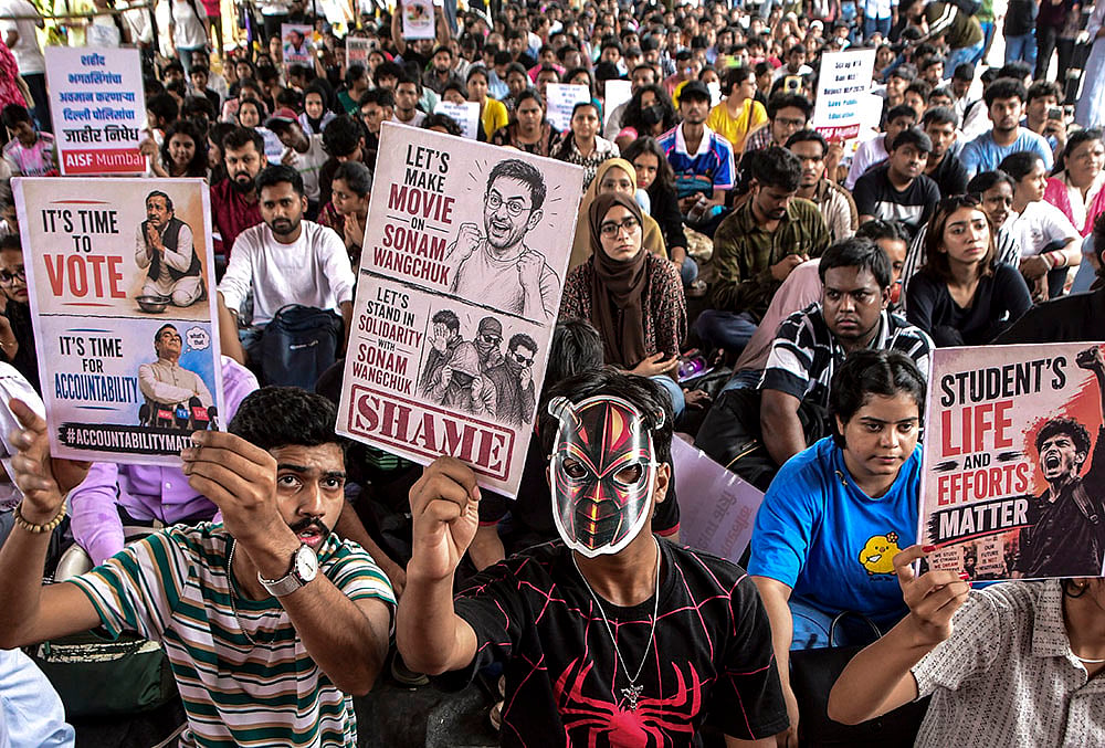 People participate in a protest at Azad Maidan demanding a transparent, accountable and corruption-free examination system, and seeking the resignation of Union Education Minister Dharmendra Pradhan over the NEET paper leak case, in Mumbai. - | Photo: PTI
