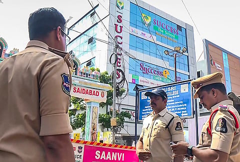 Police personnel stand outside a private school in Saidabad after a controversy erupted over allegations that a Class 2 Hindu student was assigned Islamic prayers as homework, in Hyderabad. 