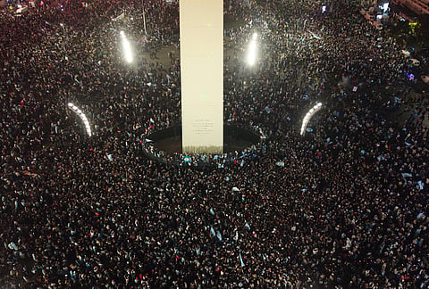 Fans celebrate Argentina's victory over England in a World Cup semifinal soccer match around the Obelisk in downtown Buenos Aires, Argentina, Wednesday, July 15, 2026. 