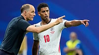 Three Lions, Zero Bite: How England’s Tactical Retreat Handed Messi A Ticket To The Final AP/Rebecca Blackwell : England head coach Thomas Tuchel talks to England's Jude Bellingham during the World Cup semifinal soccer match