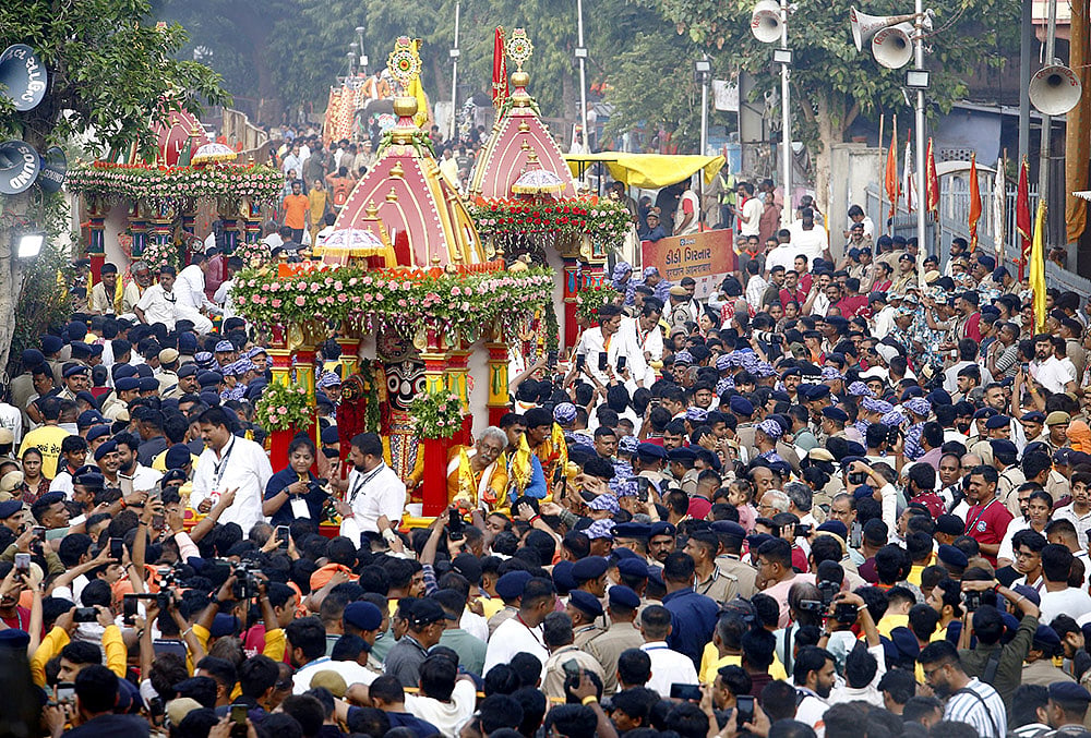 People pull chariots of Lord Jagannath, Lord Balabhadra and Goddess Subhadra on the occasion of the Rath Yatra festival, in Ahmedabad, Thursday, July 16, 2026. 