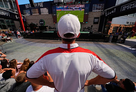 An England fan watches the final minutes of a World Cup semifinal soccer match between Argentina and England at the KC Live! entertainment district Wednesday, July 15, 2026, in Kansas City, Mo. 
