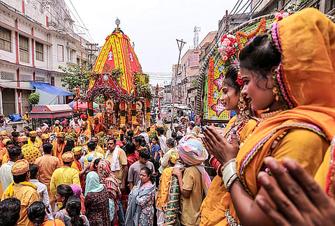 Devotees pull the chariot carrying the idols of Lord Jagannath, Lord Balabhadra and Goddess Subhadra during the annual Jagannath Rath Yatra procession, in Prayagraj.