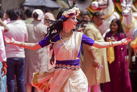 An artiste performs during the annual Rath Yatra festival celebration organised by ISKCON, in Kolkata, West Bengal, Thursday, July 16, 2026. 