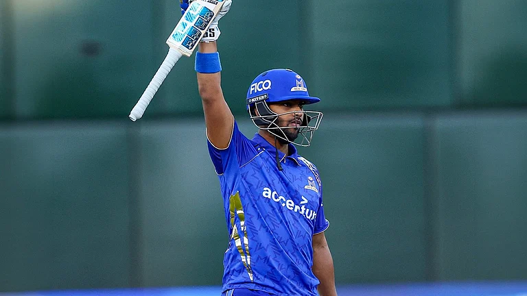 MI New York captain Nicholas Pooran celebrates after reaching his century during the MLC 2026 Eliminator against Washington Freedom. Pooran's blistering 31-ball hundred became the fastest century in Major League Cricket history and one of several records set during the historic contest. - X/MINYCricket