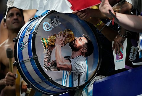 Argentina fans on the stands play a drum with a picture of team captain Lionel Messi celebrating at the end of the World Cup semifinal soccer match between England and Argentina in Atlanta, Wednesday, July 15, 2026.