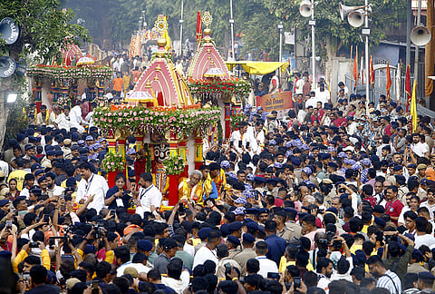 People pull chariots of Lord Jagannath, Lord Balabhadra and Goddess Subhadra on the occasion of the Rath Yatra festival, in Ahmedabad.