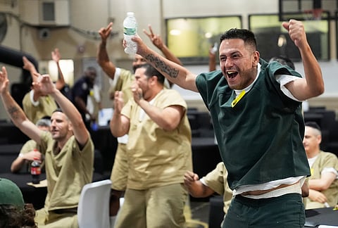 Rikers Island inmate Victor Caldas, an Argentina fan, reacts during the World Cup semifinal soccer match between England and Argentina, at the jail complex in New York, Wednesday, July 15, 2026.