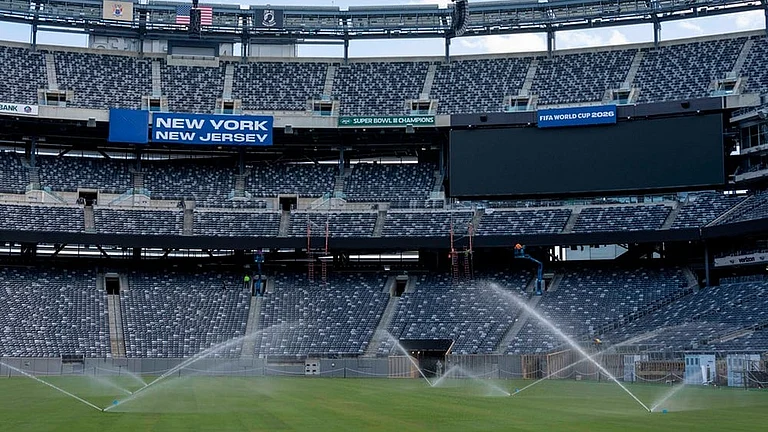 Sprinkler water grass during the pitch installation for FIFA World Cup 2026 at NYNJ Stadium in East Rutherford, New Jersey. - | Photo: AP/Yuki Iwamura