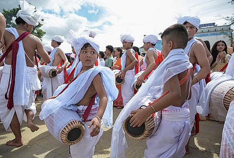 Devotees perform 'Pung Cholom', a traditional Meitei dance, during the Kang Chingba (Rath Yatra) festival at the Palace Compound, in Imphal, Manipur.