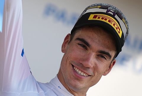 Spain's Juan Ayuso, wearing the best young rider's white jersey, celebrates on the podium after the eleventh stage of the Tour de France cycling race with start in Vichy and finish in Nevers, France, Wednesday, July 15, 2026. 