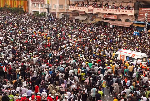 An ambulance makes its way through the crowd to evacuate devotees who fell ill following a crowd surge during the Jagannath Rath Yatra, in Puri, Odisha, Thursday, July 16, 2026.