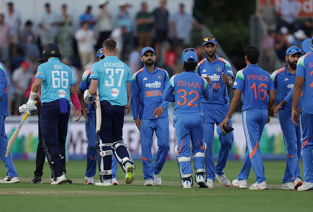 England's Joe Root and Gus Atkinson shake hands with India's players after winning the match in the second ODI between England and India at Sophia Gardens, Cardiff, Wales, Thursday July 16, 2026.  - | Photo: Steven Paston/PA via AP