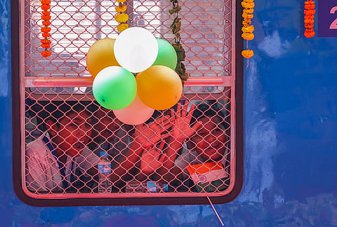 Children wave from inside the newly inaugrated India's first hydrogen-powered train, between Jind and Sonipat, at Jind Railway Station, Haryana. 