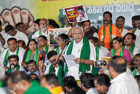 Senior BJP leader B S Yediyurappa addresses a protest against the proposed Bidadi township project, in Bengaluru, Karnataka.