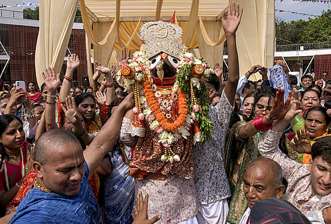 People take part in the annual Jagannath Rath Yatra procession, in Dehradun, Thursday, July 16, 2026. 
