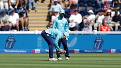 England's Jacob Bethell picks up an injured gull during the second ODI between England and India at Sophia Gardens, Cardiff, Wales, Thursday July 16, 2026 - (Steven Paston/PA via AP)