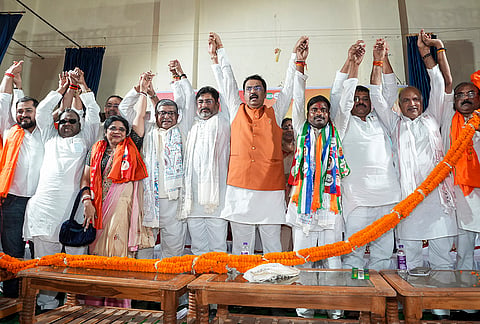 Bihar Janata Dal (United) state President Umesh Kushwaha along with BJP state President Sanjay Saraogi, NDA candidate Neeraj Kumar Sinha and others during the National Democratic Alliance (NDA) workers' conference ahead of the Bankipur Assembly by-election, at Bihar Hindi Sahitya Sammelan, in Patna.