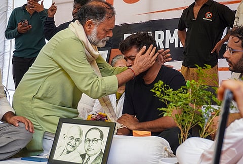 Political activist Yogendra Yadav meets Cockroach Janata Party (CJP) founder Abhijeet Dipke as he begins indefinite hunger strike at Jantar Mantar after activist Sonam Wangchuk, unseen, who has been on an indefinite hunger strike for 21 days, was shifted to a hospital for medical care, in New Delhi.