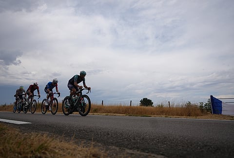 Germany's Phil Bauhaus, right, France's Ewen Costiou, second right, France's Baptiste Veistroffer, second left, and France's Matteo Vercher ride in a breakaway during the twelfth stage of the Tour de France cycling race with start in Circuit Nevers Magny-Cours and finish in Chalon-sur-Saone, France, Thursday, July 16, 2026. 