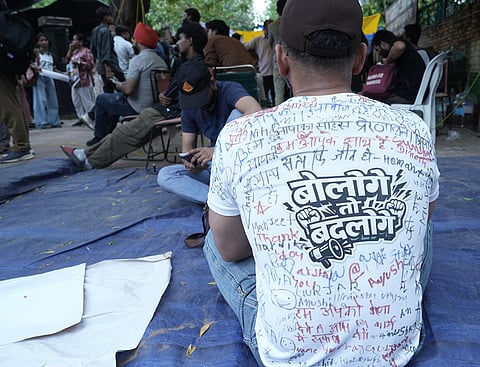 Supporters of Cockroach Janta Party during a protest demanding the resignation of Education Minister Dharmendra Pradhan over alleged examination irregularities and repeated paper leaks in New Delhi.