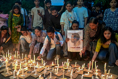 Activists and students light candles during a vigil in solidarity with educator and climate activist Sonam Wangchuk, who has been on an indefinite hunger strike for 21 days in protest demanding Pradhan's resignation over alleged irregularities in the NEET examination, in Nagpur, Maharashtra, Saturday, July 18, 2026. Wangchuk was forcibly removed during his hunger strike from the Jantar Mantar earlier in the day by the Delhi Police and whisked away to Safdarjung Hospital. 