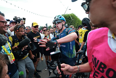 Belgium's Tim Merlier celebrates as he crosses the finish line to win the twelfth stage of the Tour de France cycling race with start in Circuit Nevers Magny-Cours and finish in Chalon-sur-Saone, France, Thursday, July 16, 2026. 