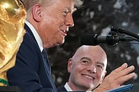 US President Donald Trump, Gianni Infantino Give World Cup High Praise, Call Tournament A Success AP : U.S. President Donald Trump and FIFA president Gianni Infantino stand next to the FIFA World Cup Trophy during a reception at Trump Tower in New York City