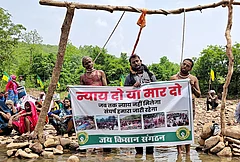 Tribals and farmers affected by the Ken-Betwa river-linking project stage a symbolic ‘hanging satyagraha’ by placing nooses around their necks demanding full rehabilitation or state-sanctioned euthanasia, in Chhatarpur district, Madhya Pradesh. - | Photo: PTI
