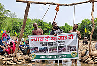 | Photo: PTI : Tribals and farmers affected by the Ken-Betwa river-linking project stage a symbolic ‘hanging satyagraha’ by placing nooses around their necks demanding full rehabilitation or state-sanctioned euthanasia, in Chhatarpur district, Madhya Pradesh.