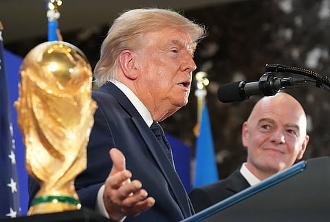 US President Donald Trump speaks as FIFA President Gianni Infantino listens at a reception at Trump Tower in New York, Friday, July 17, 2026.