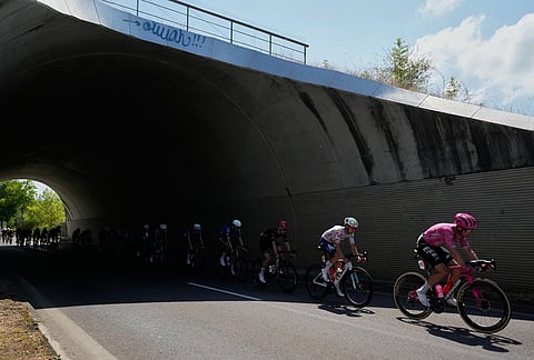 The pack rides during the thirteenth stage of the Tour de France cycling race with start in Dole and finish in Belfort, France, Friday, July 17, 2026. 