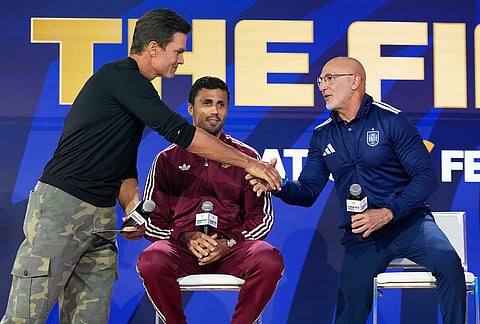 Spain's Rodri watches as American football player Tom Brady greets head coach Luis de la Fuente during a news conference ahead of the World Cup final soccer match between Spain and Argentina in New York, Friday, July 17, 2026. 

