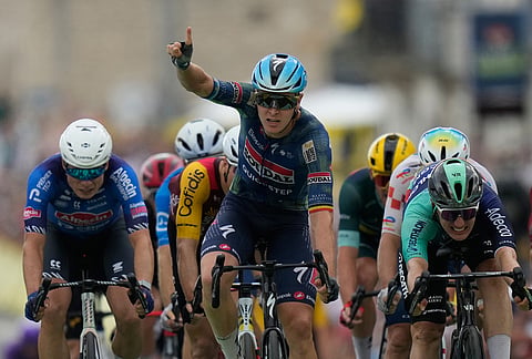 Belgium's Tim Merlier celebrates as he crosses the finish line to win the twelfth stage of the Tour de France cycling race with start in Circuit Nevers Magny-Cours and finish in Chalon-sur-Saone, France, Thursday, July 16, 2026. 