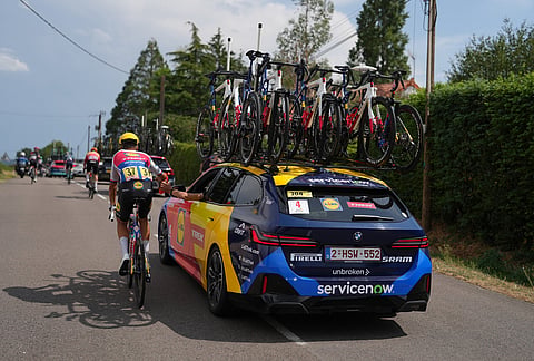 Mathias Vacek of the Czech Republic, takes water from sport director during the twelfth stage of the Tour de France cycling race with start in Circuit Nevers Magny-Cours and finish in Chalon-sur-Saone, France, Thursday, July 16, 2026. 