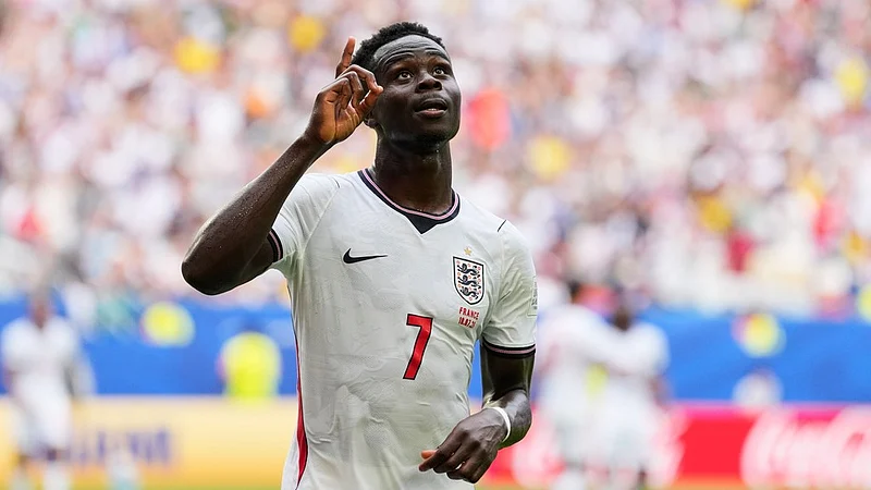 Rebecca Blackwell/AP Photo : Englands Bukayo Saka (7) celebrates scoring his sides fourth goal during the World Cup third-place playoff soccer match between France and England in Miami Gardens