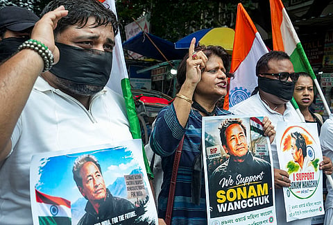 Indian National Trade Union Congress (INTUC) supporters take out a rally in solidarity with activist Sonam Wangchuk outside the University of Calcutta, in Kolkata, West Bengal. Wangchuk, who has been on an indefinite hunger strike for 21 days, was shifted to a hospital in Delhi for medical care. 