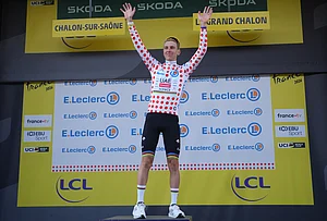 | Photo: AP/Thibault Camus : Slovenia's Tadej Pogacar, wearing the best climber's dotted jersey celebrates on the podium after the twelfth stage of the Tour de France cycling race with start in Circuit Nevers Magny-Cours and finish in Chalon-sur-Saone, France, Thursday, July 16, 2026.