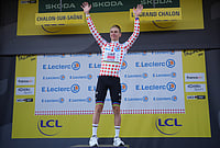 | Photo: AP/Thibault Camus : Slovenia's Tadej Pogacar, wearing the best climber's dotted jersey celebrates on the podium after the twelfth stage of the Tour de France cycling race with start in Circuit Nevers Magny-Cours and finish in Chalon-sur-Saone, France, Thursday, July 16, 2026. 