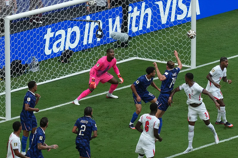 Englands Ezri Konsa (2) heads the ball past France goalkeeper Mike Maignan (16) to score their second goal during the World Cup third-place playoff soccer match between France and England in Miami Gardens