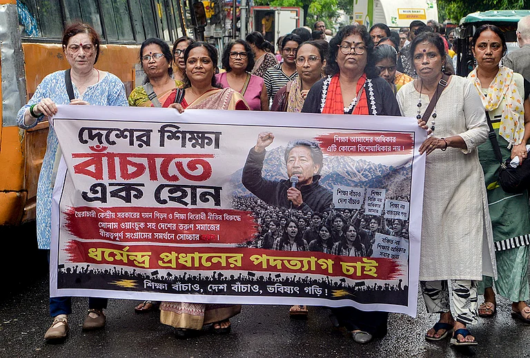 CPI(M) supporters take out a protest march in solidarity with climate activist Sonam Wangchuk, who is on hunger strike demanding Union Education Minister Dharmendra Pradhan's resignation over alleged irregularities in the NEET examination, in Siliguri, West Bengal, Saturday, July 18, 2026. - | Photo: PTI