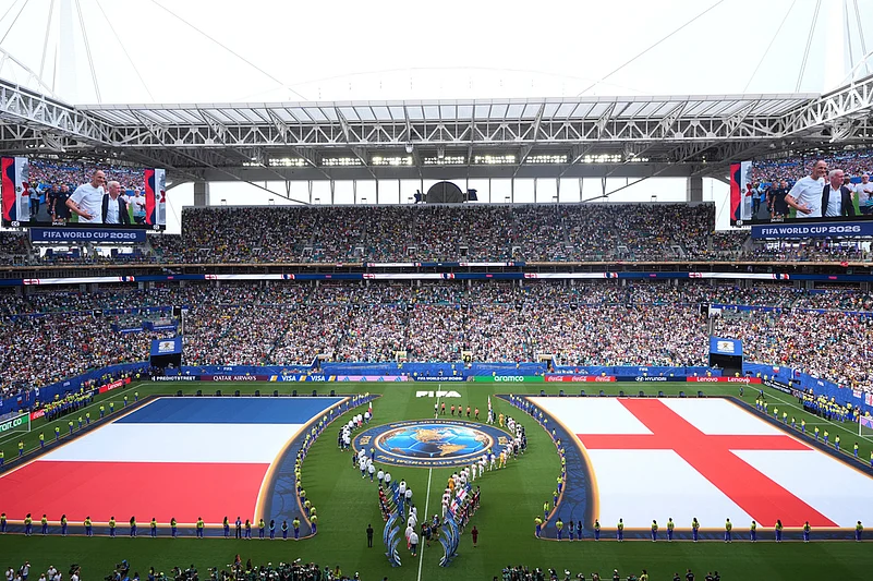 Teams march onto the pitch ahead of the World Cup third-place playoff soccer match between France and England in Miami Gardens