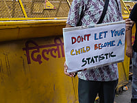 'Democracy Doesn't Die Overnight': Voices From Jantar Mantar After Wangchuk's Removal Ainnie Arif : A demonstrator holds a placard during a protest at Jantar Mantar on July 18 demanding the resignation of Union Education Minister Dharmendra Pradhan. |