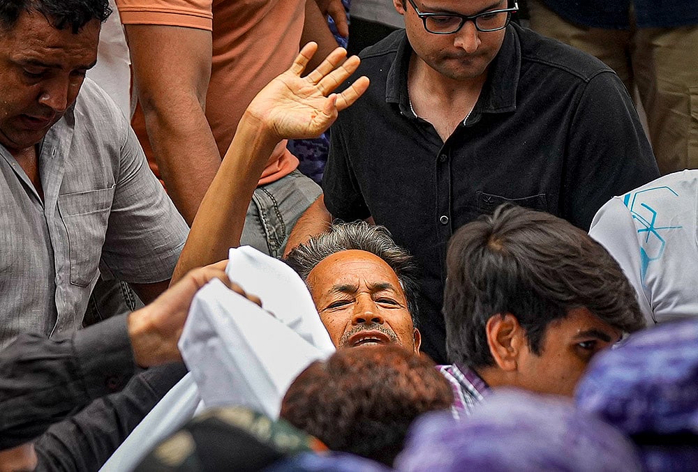 | Photo: PTI/Salman Ali : Activist Sonam Wangchuk, who has been on an indefinite hunger strike for 21 days, waves as he is shifted to a hospital from Jantar Mantar, in New Delhi, Saturday, July 18, 2026. 