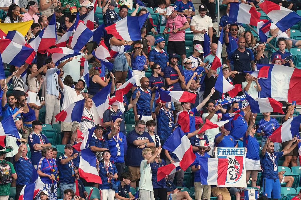France supporters cheer ahead the World Cup third-place playoff soccer match between France and England in Miami Gardens,