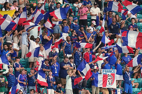 France supporters cheer ahead the World Cup third-place playoff soccer match between France and England in Miami Gardens,