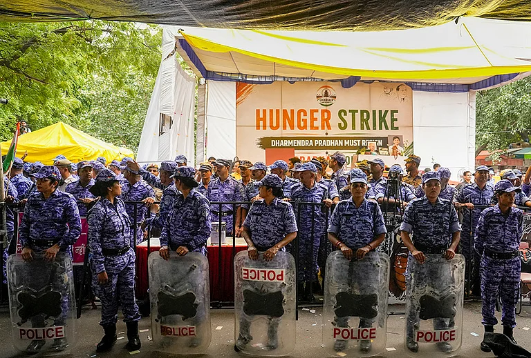 Security personnel stand guard as activist Sonam Wangchuk, unseen, who has been on an indefinite hunger strike for 21 days, is shifted to a hospital from Jantar Mantar, in New Delhi, Saturday, July 18, 2026. - | Photo: PTI/Salman Ali
