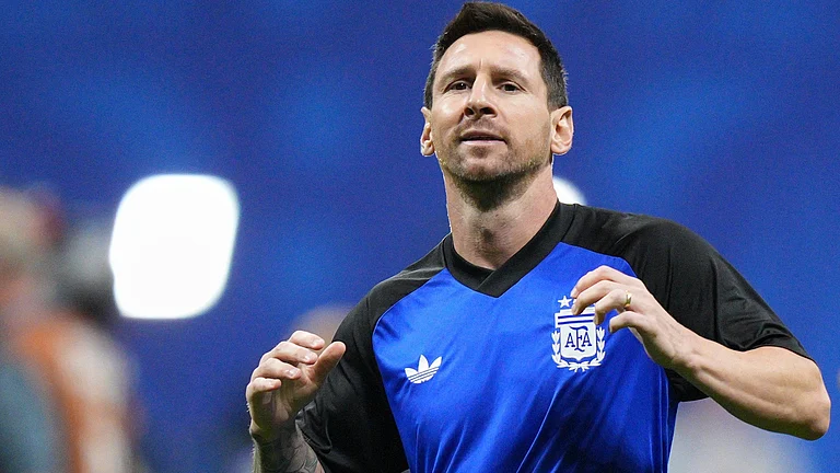 Argentina's Lionel Messi (10) warms up before the World Cup semifinal soccer match between England and Argentina in Atlanta - AP/Jacob Kupferman